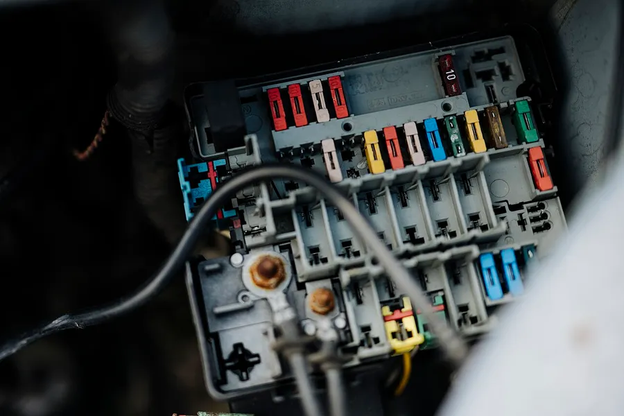 Fuse box with relays and fuses during an electrical fault diagnosis